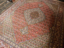 Load image into Gallery viewer, Large Vintage Hand-Knotted Wool Rug – Geometric Medallion & Floral Border – 7'1" × 5'