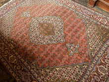 Load image into Gallery viewer, Large Vintage Hand-Knotted Wool Rug – Geometric Medallion & Floral Border – 7'1" × 5'