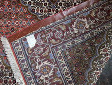 Load image into Gallery viewer, Large Vintage Hand-Knotted Wool Rug – Geometric Medallion & Floral Border – 7'1" × 5'