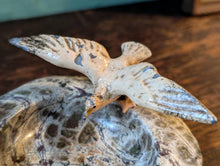 Load image into Gallery viewer, Mid-Century Stone Dish / Ash Tray With Flying Gull – Cold Painted Spelter Bird on Polished Rock, C. 1950s – 11.5 cm Diameter