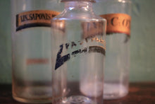 Load image into Gallery viewer, Antique Apothecary Bottle Trio With Stoppers, Original Pharmacy Labels, Clear Glass Chemist Jars, Tallest 25 cm (9.84")
