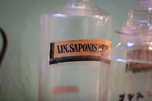 Load image into Gallery viewer, Antique Apothecary Bottle Trio With Stoppers, Original Pharmacy Labels, Clear Glass Chemist Jars, Tallest 25 cm (9.84")