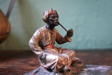 Load image into Gallery viewer, Cold-Painted Spelter Bergman Style Figure – Turbaned Pipe Smoker on Carpet Tray