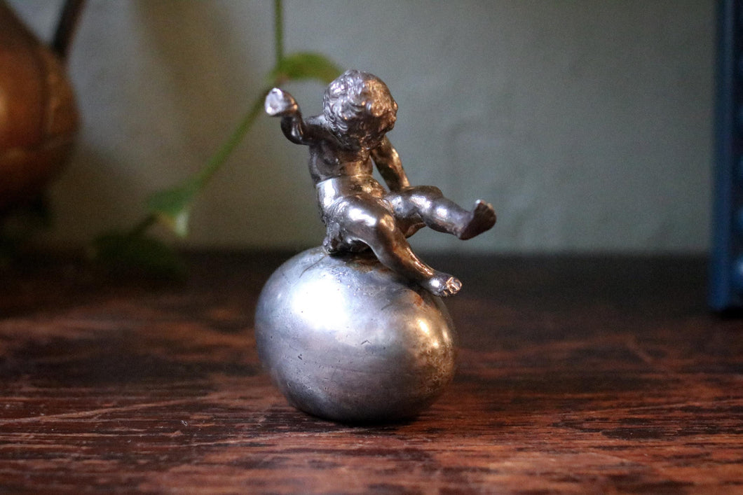 Vintage Boy Sitting on Egg Figurine Casting