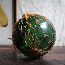 Load image into Gallery viewer, Antique British Glass Fishing Float with Net — “FGC” Maker’s Mark (Forsters Glass Co.), c. 1920–40
