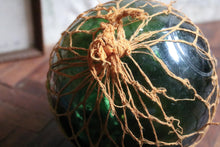 Load image into Gallery viewer, Antique British Glass Fishing Float with Net — “FGC” Maker’s Mark (Forsters Glass Co.), c. 1920–40
