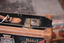 Load image into Gallery viewer, Vintage Stickered Travel Suitcase – Swedish American Line, Trans-Canada Air Lines &amp; Hotel Labels – 1930s–50s – 55 × 16 × 34 cm
