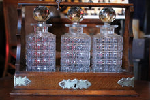 Load image into Gallery viewer, Antique Edwardian Wooden Tantalus Decanter Set – Cut Glass Bottles With Key
