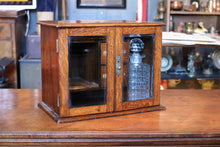 Load image into Gallery viewer, 1920s Oak Drinks /Smokers Cabinet – Glass Fronted – Cut Glass Decanter – Inscribed Presentation Piece – 39cm
