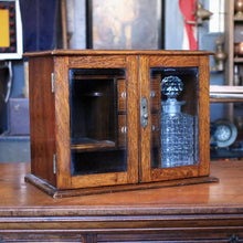 Load image into Gallery viewer, 1920s Oak Drinks /Smokers Cabinet – Glass Fronted – Cut Glass Decanter – Inscribed Presentation Piece – 39cm
