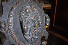 Load image into Gallery viewer, Antique Black Forest Carved Wall Plaque - Rotating Green Man Carving - Gothic Folk Art Oak Panel - 53 x 39 cm

