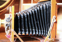 Load image into Gallery viewer, Antique Mahogany Field Camera With Brass Lens – Large Format Bellows Camera
