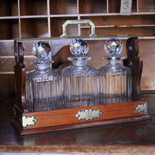 Load image into Gallery viewer, Antique Mahogany 3 Bottle Tantalus - Cut Glass Decanters - Silver Plated Fittings
