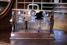 Load image into Gallery viewer, Antique Mahogany 3 Bottle Tantalus - Cut Glass Decanters - Silver Plated Fittings
