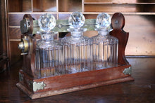 Load image into Gallery viewer, Antique Mahogany 3 Bottle Tantalus - Cut Glass Decanters - Silver Plated Fittings
