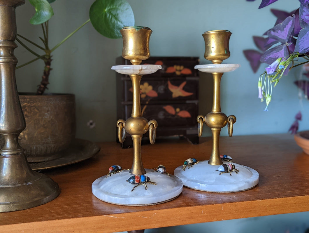 A pair of early 20thC Continental brass and marble candlesticks